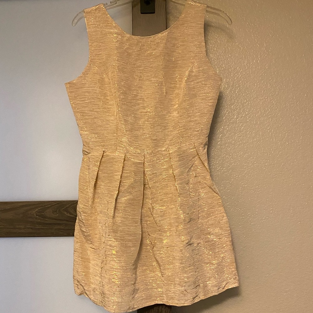 Gold stitch cocktail dress.